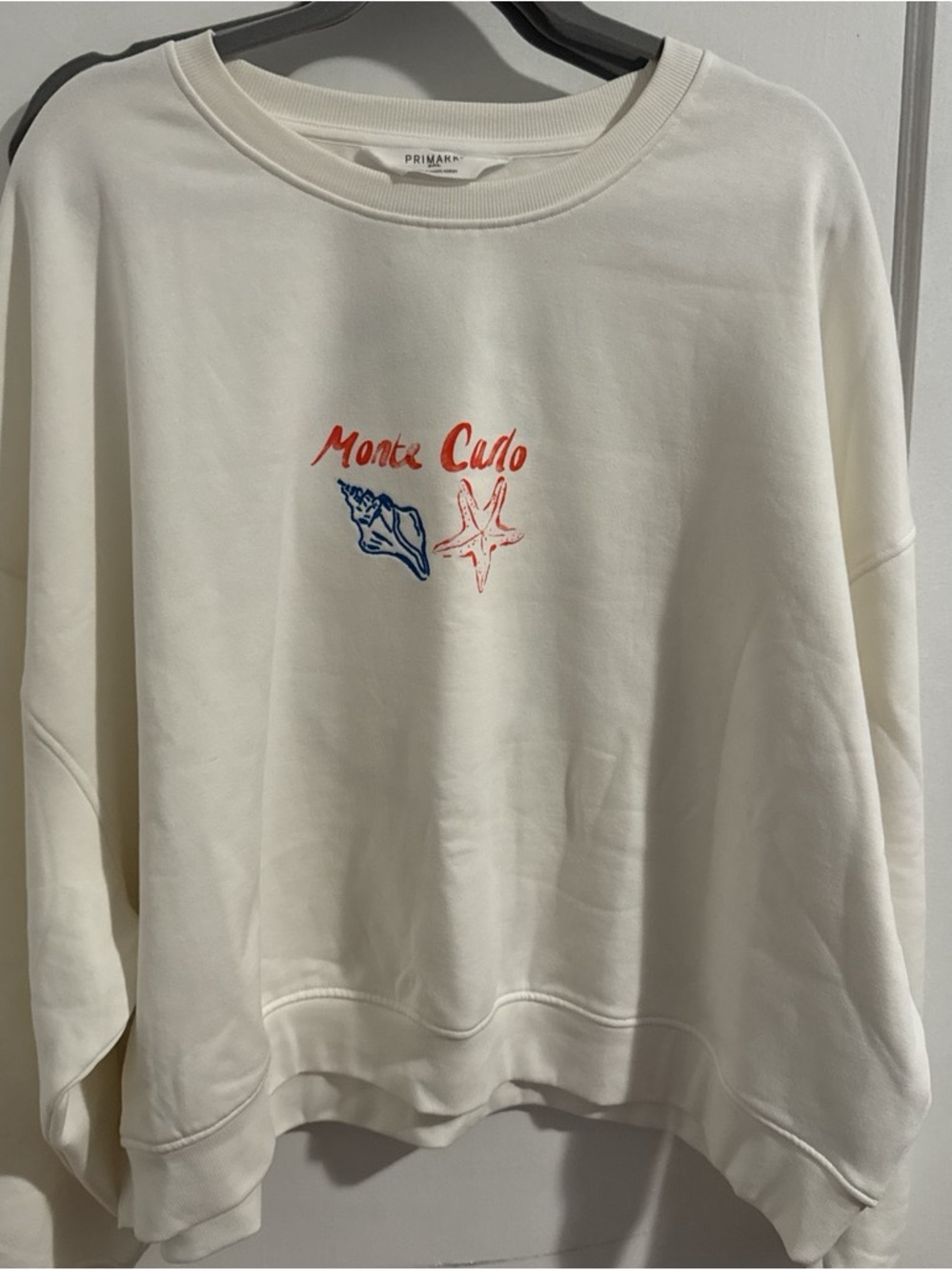 Primark Cream Crewneck with Red Script & Blue Shell Motif